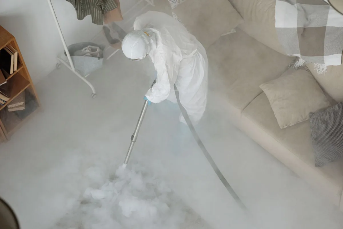 Biohazard cleanup technician in protective equipment, Jacksonville, OR
